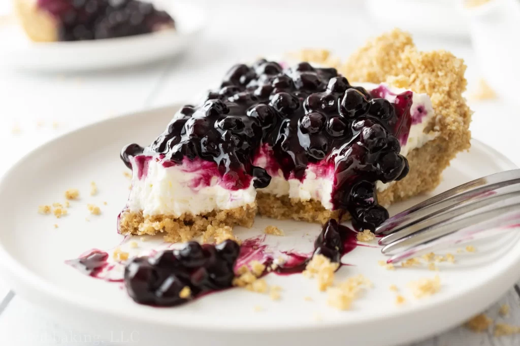 Blueberry Cream Cheese Pie slice of pie with fork scaled 1